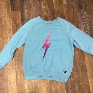 Aviator Nation blue lightning bolt. Lightly worn but still in great condition!